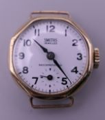 A 1950s Smiths 9 ct gold ladies wristwatch with a white dial, in working order.