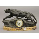 A 19th century French spelter mantle clock mounted on a marble plinth base,