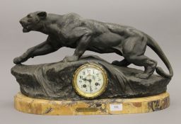 A 19th century French spelter mantle clock mounted on a marble plinth base,