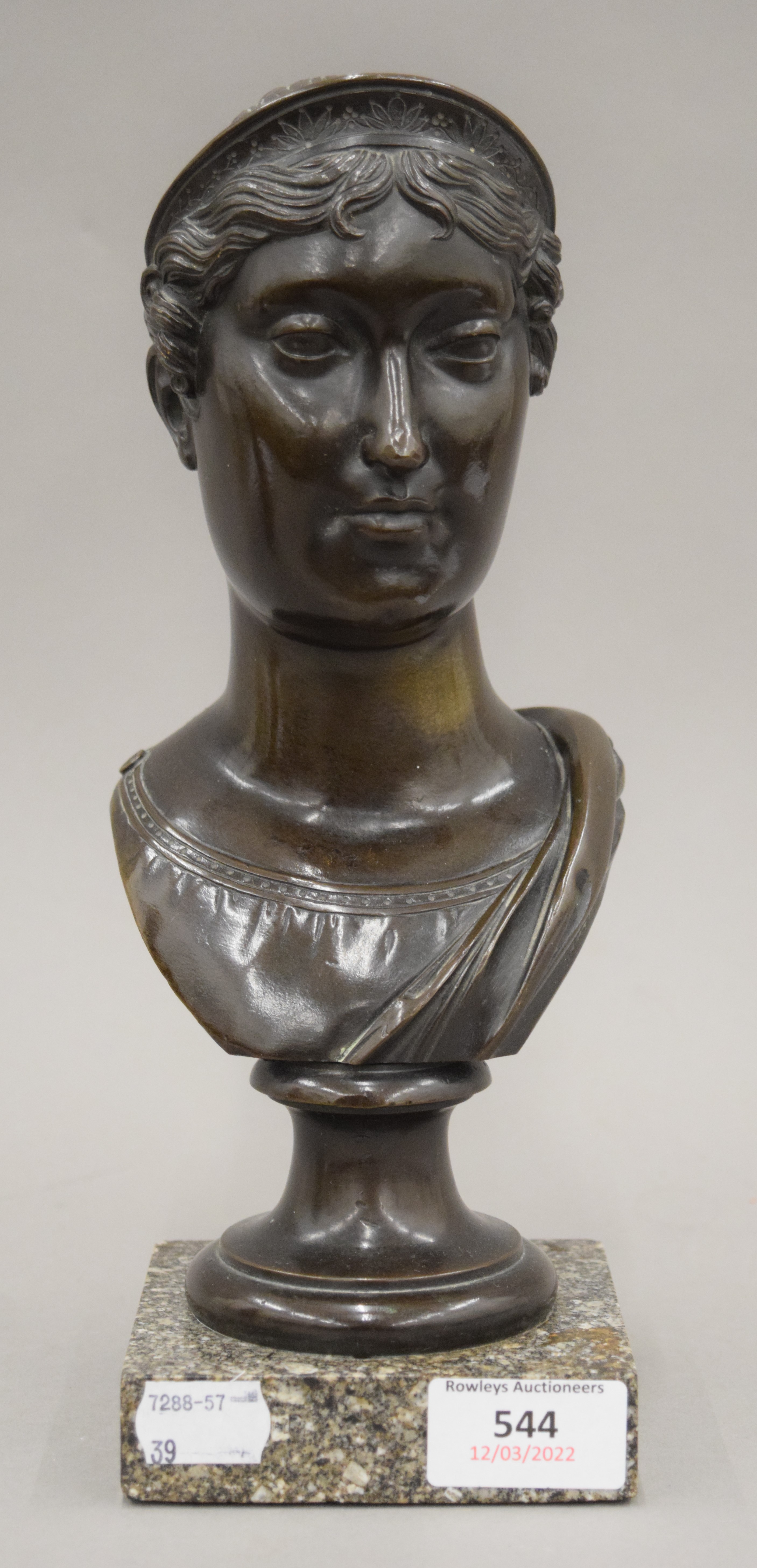 A 19th century bronze bust of a classical lady mounted on a marble plinth base. 27 cm high.