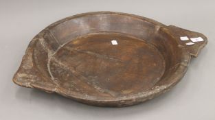A large treen bowl. 60.5 cm wide.