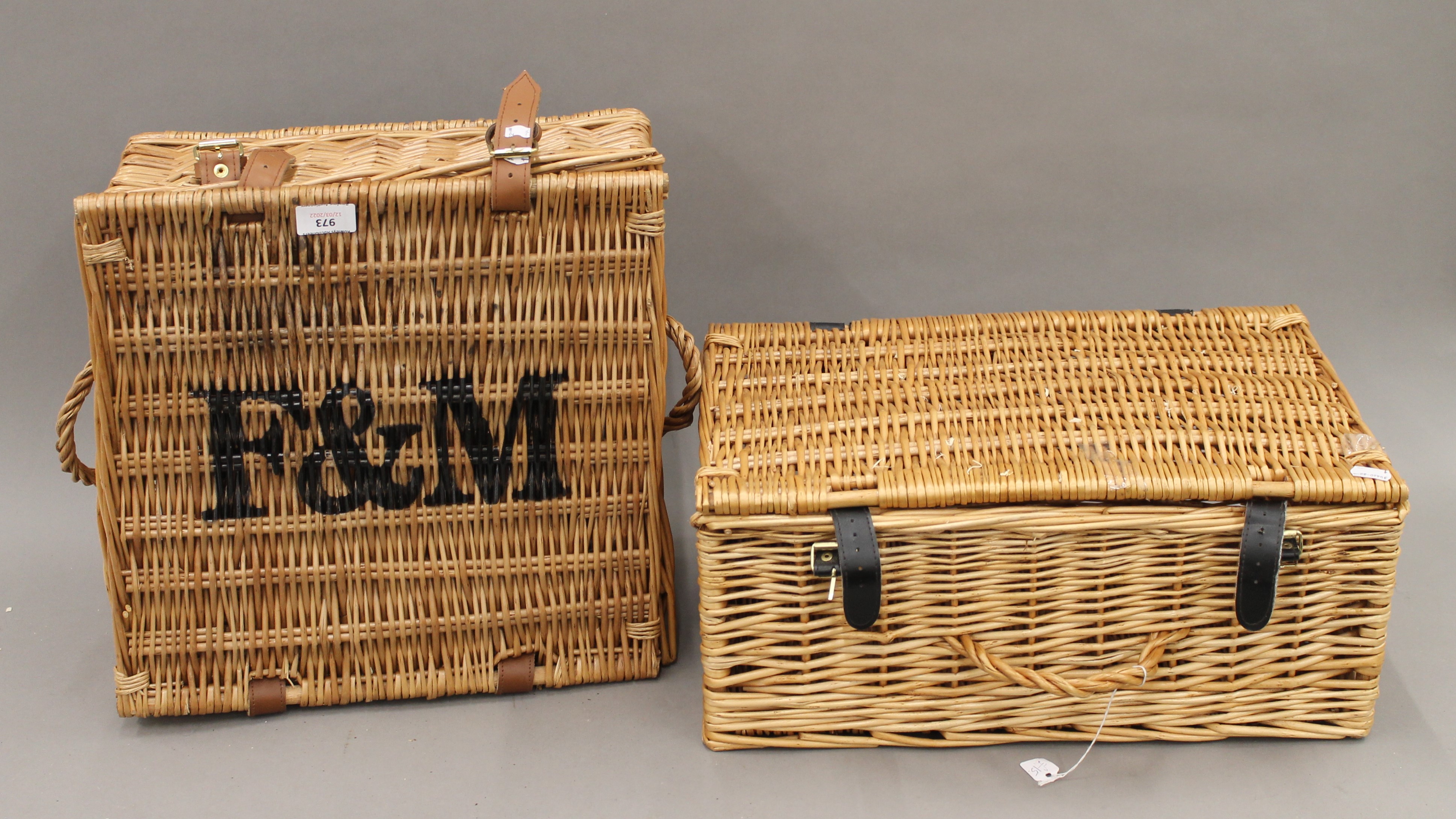 A Fortnum and Masons wicker basket and another wicker basket. The former 38 cm wide.