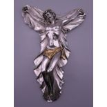 A silver clad crucifix. 20 cm high.