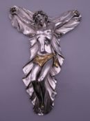 A silver clad crucifix. 20 cm high.
