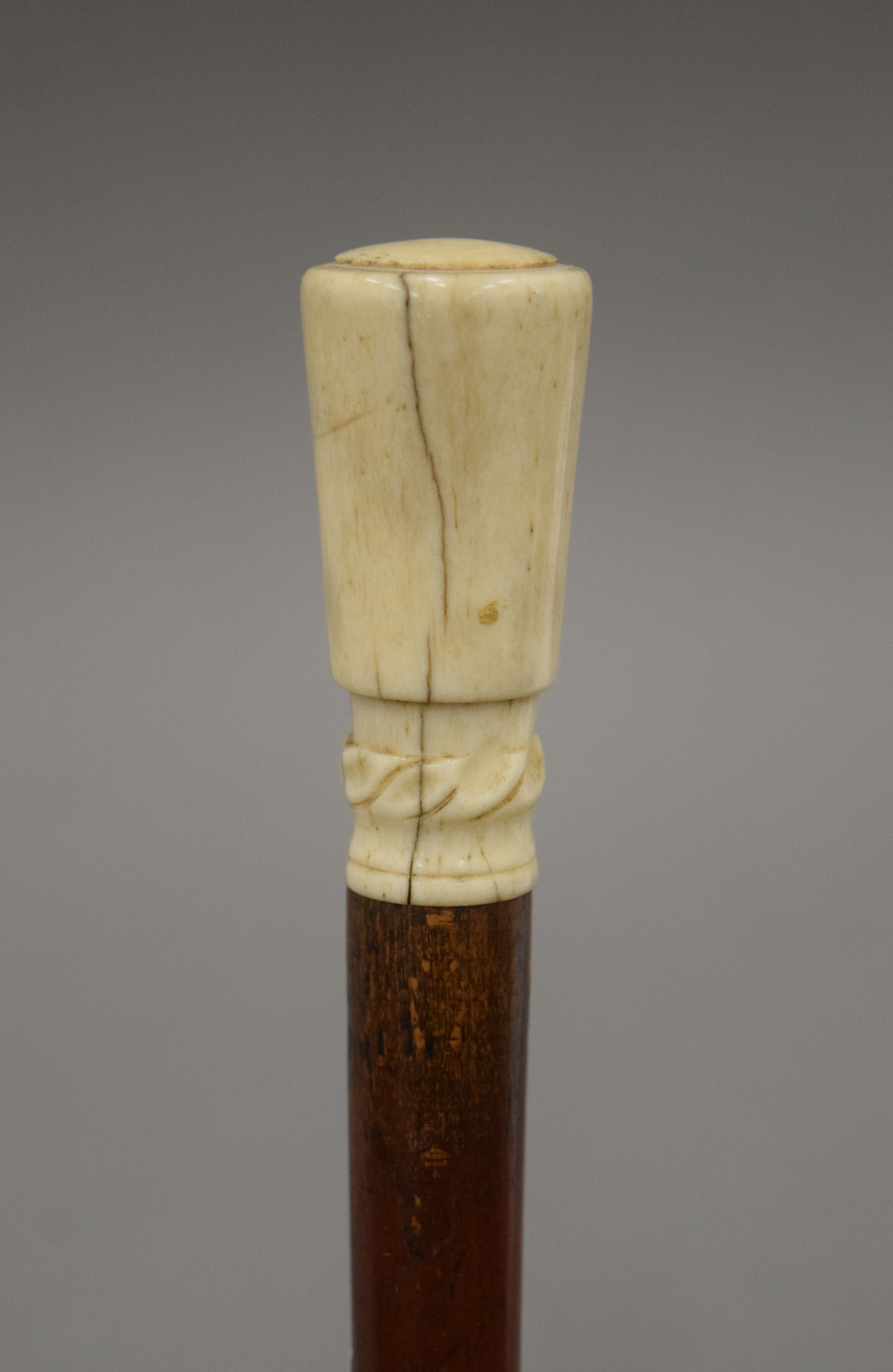 A Victorian ivory handled walking stick with detachable handle and ferrule, and hollow shaft. 88.