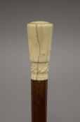 A Victorian ivory handled walking stick with detachable handle and ferrule, and hollow shaft. 88.