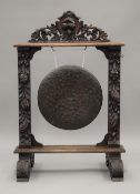 A Victorian carved oak gong. 104 cm high.