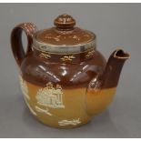 A Doulton Lambeth stoneware teapot with silver rim. 10 cm high.