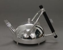 A Christopher Dresser style teapot. 15 cm high.
