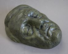 A bronze model of a death mask of Hitler. 25 cm high.