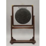 A 20th century bronze gong on brass mounted mahogany stand. 101 cm high.