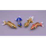 Four enamel decorated fish. The largest 9.5 cm long.