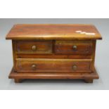 A miniature chest of drawers. 40 cm wide.