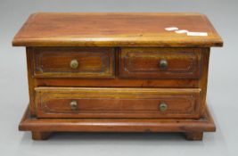 A miniature chest of drawers. 40 cm wide.