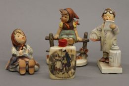 Three Hummel figures and a miniature gin barrel. The largest 14.5 cm high.