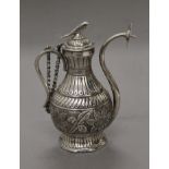 An Eastern unmarked white metal ewer. 13.5 cm high. 191.2 grammes.