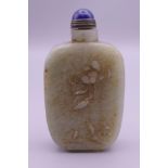 A Chinese carved jade snuff bottle. 7.5 cm high.