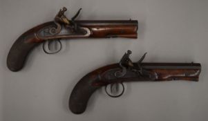 A pair of 19th century flintlock pistols. 27.5 cm long.