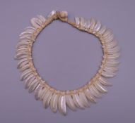 An unusual South Seas shell necklace. 38 cm long.