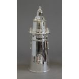 A silver plated cocktail shaker formed as a lighthouse. 35 cm high.