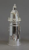 A silver plated cocktail shaker formed as a lighthouse. 35 cm high.