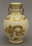 A Coalport vase decorated with dragons. 21.5 cm high.