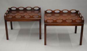 A pair of mahogany butler's trays on stands. Each 71.5 cm wide.