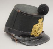 A Victorian 18th Regiment of Foot Shako, made by Edward Smith.