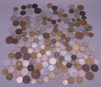 A collection of various coins, including silver.