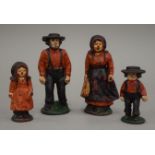 A cast iron American Amish farming family group. The largest 10.5 cm high.