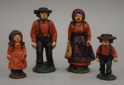 A cast iron American Amish farming family group. The largest 10.5 cm high.