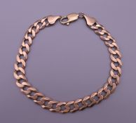 A 9 ct gold curb link bracelet. 22.5 cm long. 18.4 grammes.