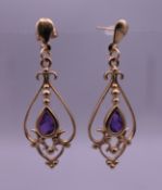 A pair of 9 ct gold amethyst earrings. 3 cm high. 1.9 grammes total weight.