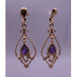 A pair of 9 ct gold amethyst earrings. 3 cm high. 1.9 grammes total weight.