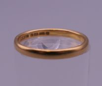 A 22 ct gold wedding band. Ring size L/M. 2.5 grammes.