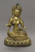A gilt bronze model of Buddha. 20 cm high.