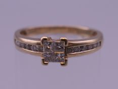 A ladies 9 ct gold princess cut diamond ring. Diamonds 1/3 carat. Ring size O. 2.