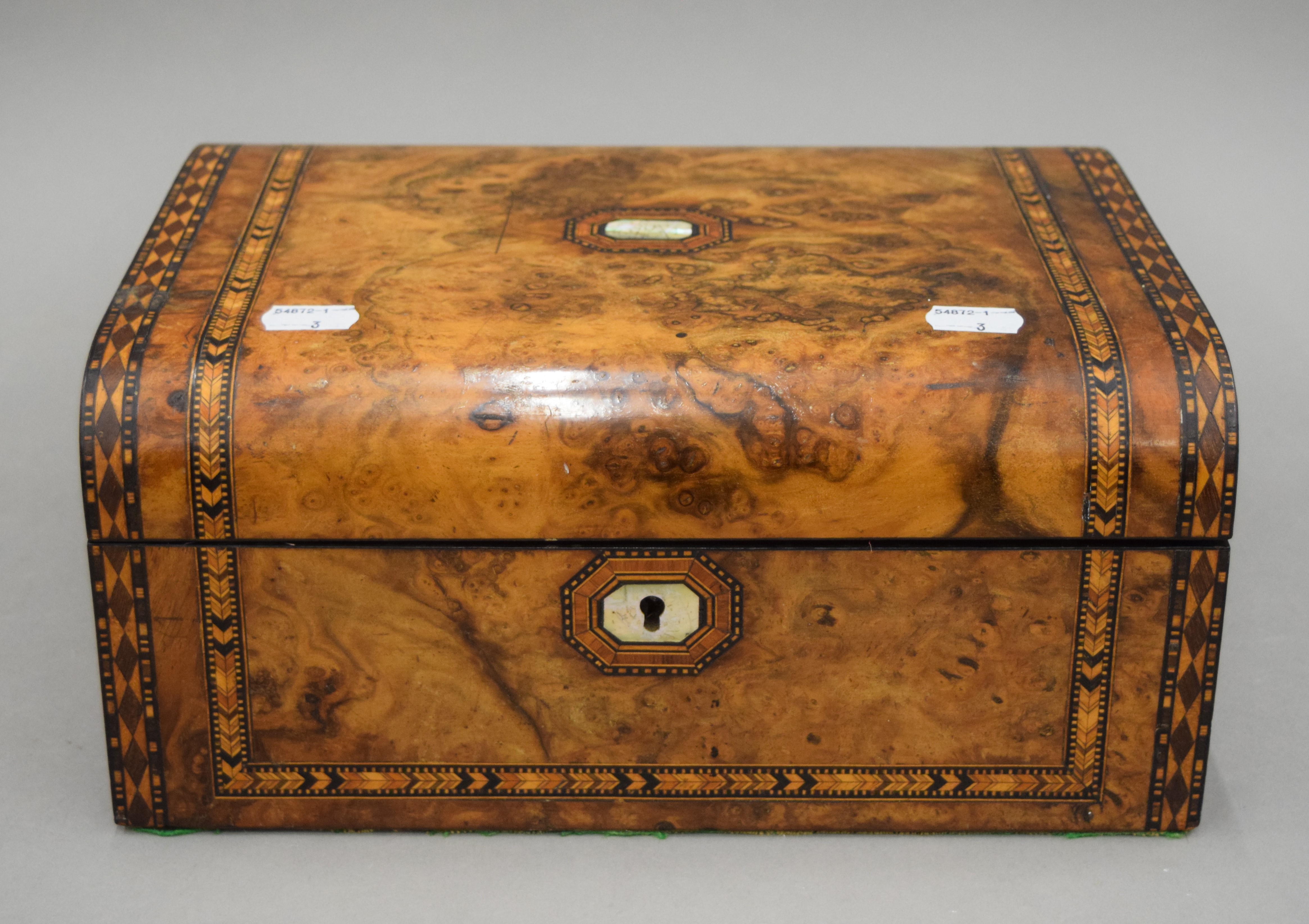 A Victorian inlaid walnut sewing box. 30 cm wide.