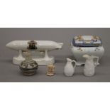 A crested ware air ship, a Japanese porcelain box and four miniature pottery vessels.
