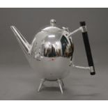 A Christopher Dresser style teapot. 16 cm high.