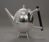 A Christopher Dresser style teapot. 16 cm high.