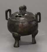 A Chinese bronze lidded censer. 14 cm wide.