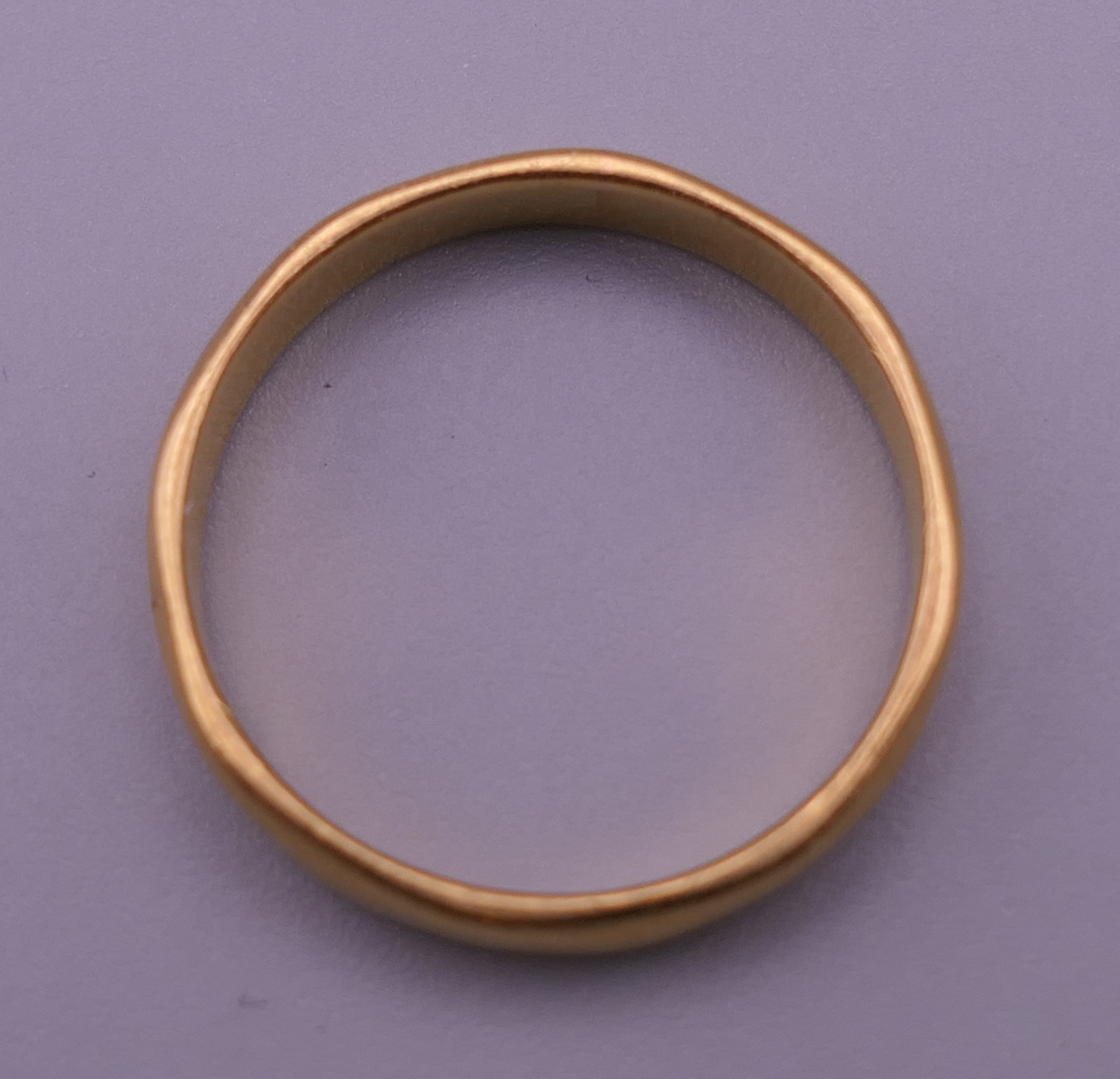 A 22 ct gold wedding band. Ring size N/O. 3.6 grammes. - Image 2 of 4