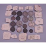 A coin collection, including various early and silver coins, and tokens.