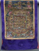 A Tibetan Thangka. 63 cm wide.