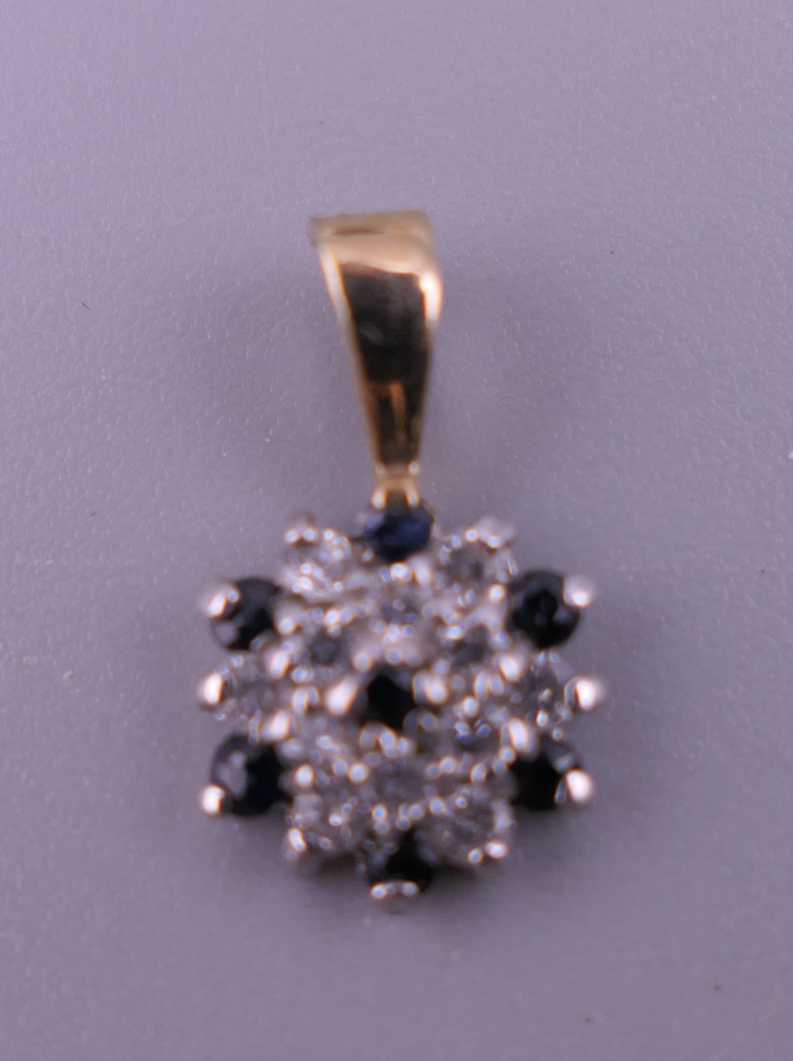 A pair of 9 ct gold and white gold sapphire earrings and matching pendant. 1.7 grammes total weight. - Image 2 of 5