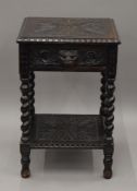 A Victorian carved oak single drawer side table. 45 cm wide.
