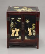 A Chinese hardstone mounted side cabinet. 50.5 cm wide x 60.5 cm high.