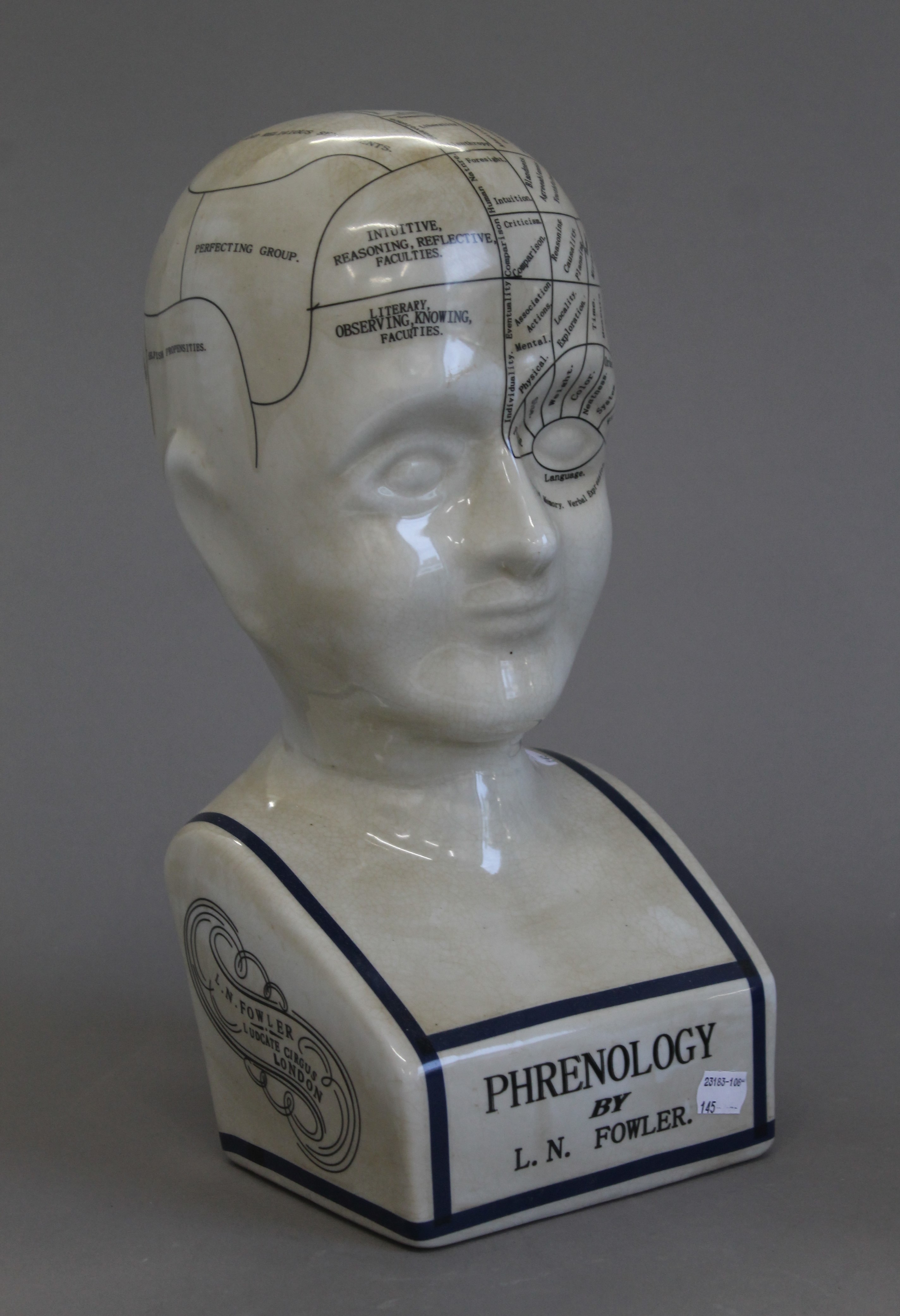 A large porcelain phrenology head. 39 cm high.