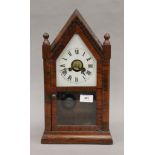 A 19th century rosewood mantle clock. 39.5 cm high.